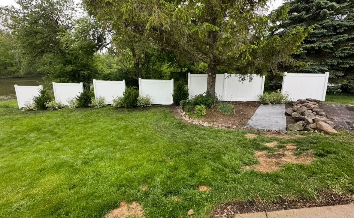Elegant Vinyl Fence and Lush Greenery Oasis image
